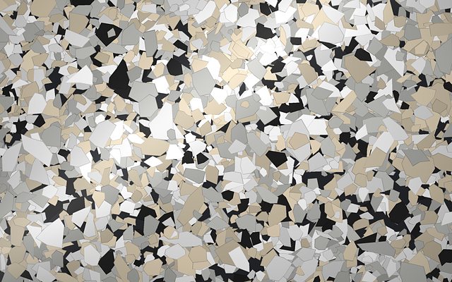 Rendered swatch of River Rocks flake colors: light granite gray, cream and white with black